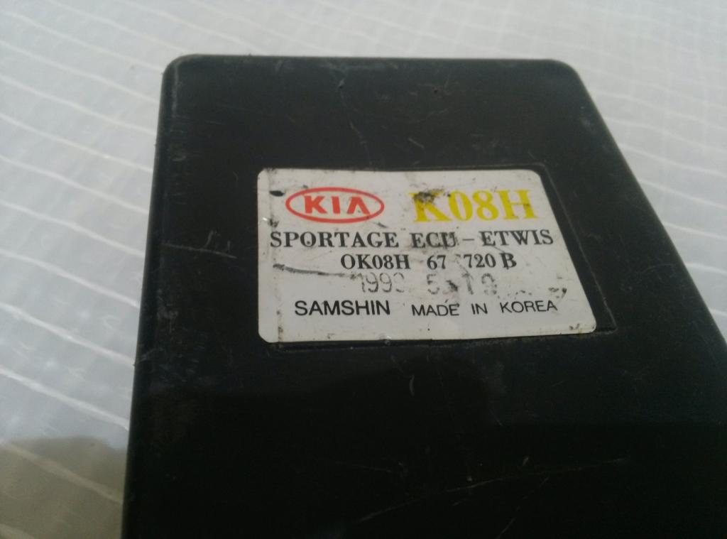 KIA SPORTAGE ECU 0K08H67720B Riadiaca jednotka vstreku (poškodený obal RJ)