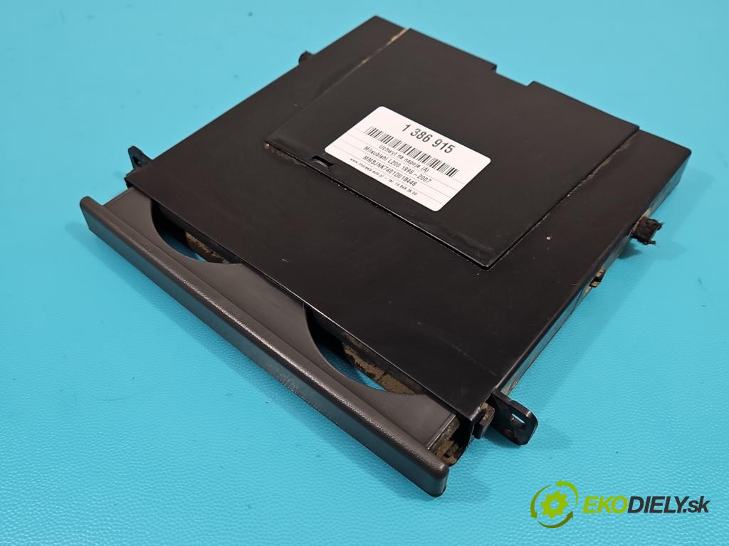 Mitsubishi L200 1996-2007 2.5d 75 HP manual 55 kW 2477 cm3 5- Rukojeť: na nápoje: MB869860-01 (Úchyty, držiaky na nápoje)