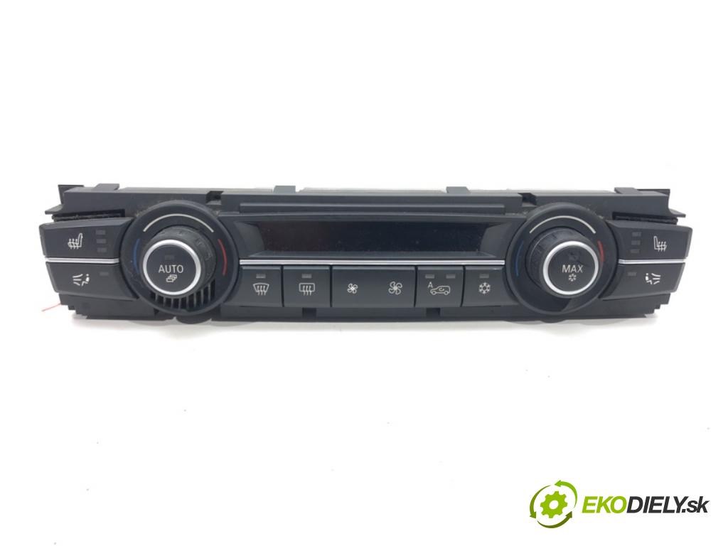 BMW E70 SUV 2009 200 kW 3.0 si 2996 Panel ovládania kúrenia 9193966 (Prepínacie páčky pod volantom)