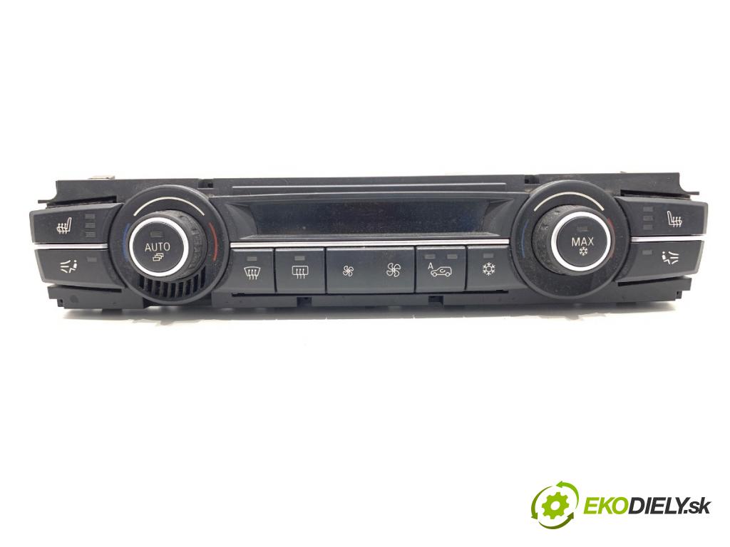 BMW E70 SUV 2009 200 kW 3.0 si 2996 Panel ovládania kúrenia 9193966 (Prepínacie páčky pod volantom)