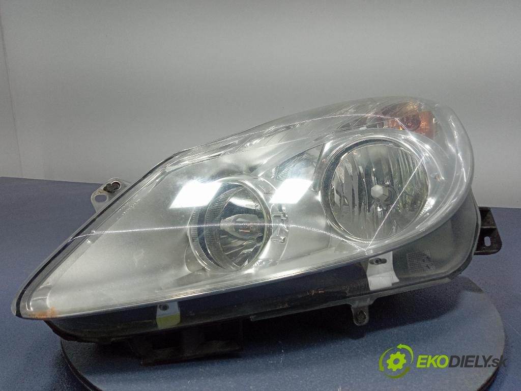 Opel Corsa 2007 Reflektor: Vľavo: 13186381