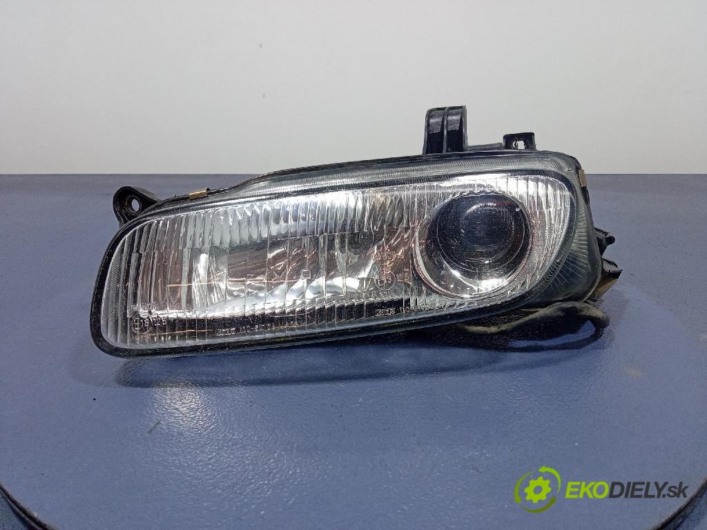 Mazda 323f 1997 Reflektor: Vľavo: 110-61708
