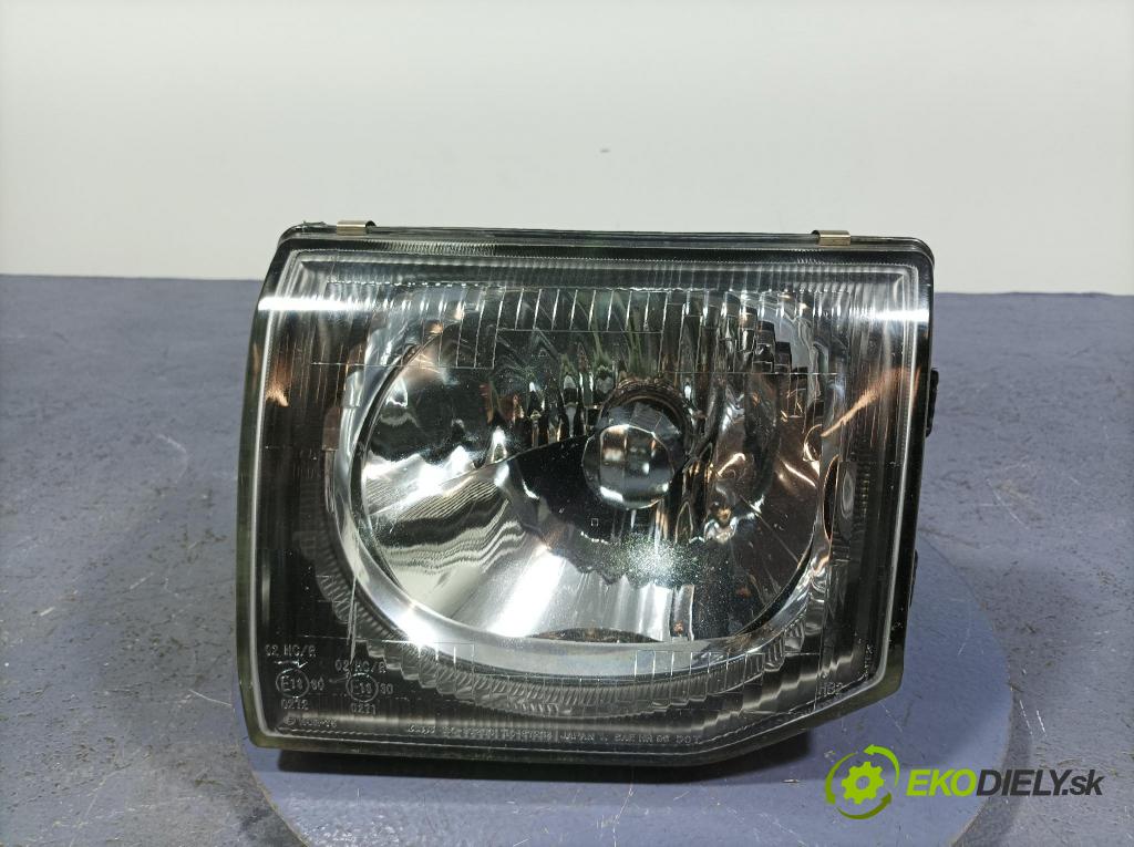 Mitsubishi Pajero 1999 Reflektor: Vľavo: 110-87234